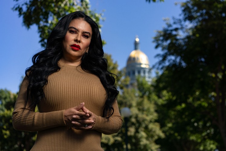 Portrait of Julissa Soto in front of the Colorado state capitol. Photo by Lance Murphey for Debt Free Justice