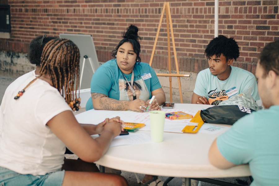 young people gathered at a table