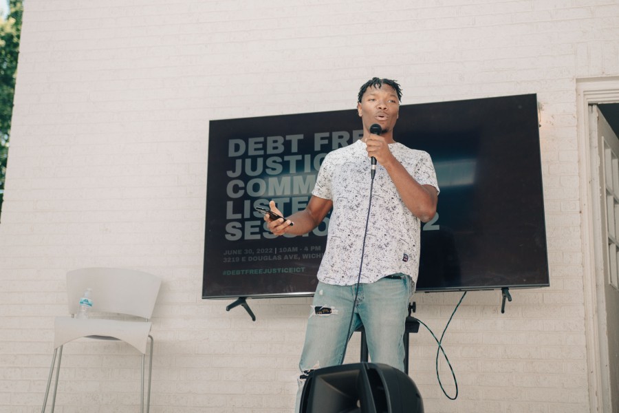 young person speaking on microphone