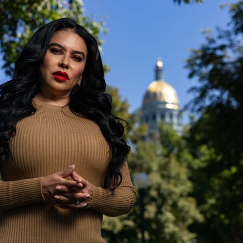 Portrait of Julissa Soto in front of the Colorado state capitol. Photo by Lance Murphey for Debt Free Justice