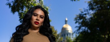 Portrait of Julissa Soto in front of the Colorado state capitol. Photo by Lance Murphey for Debt Free Justice
